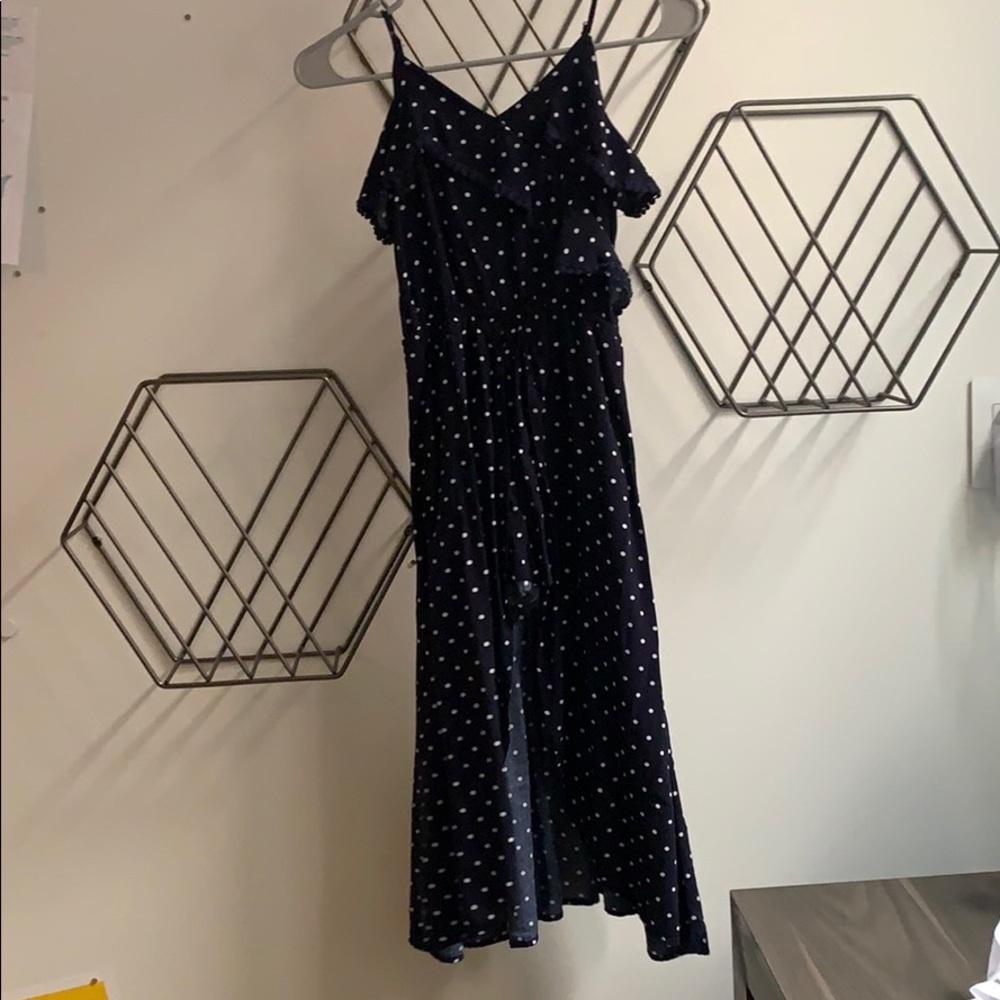 Navy blue and white romper with skirt attachment.